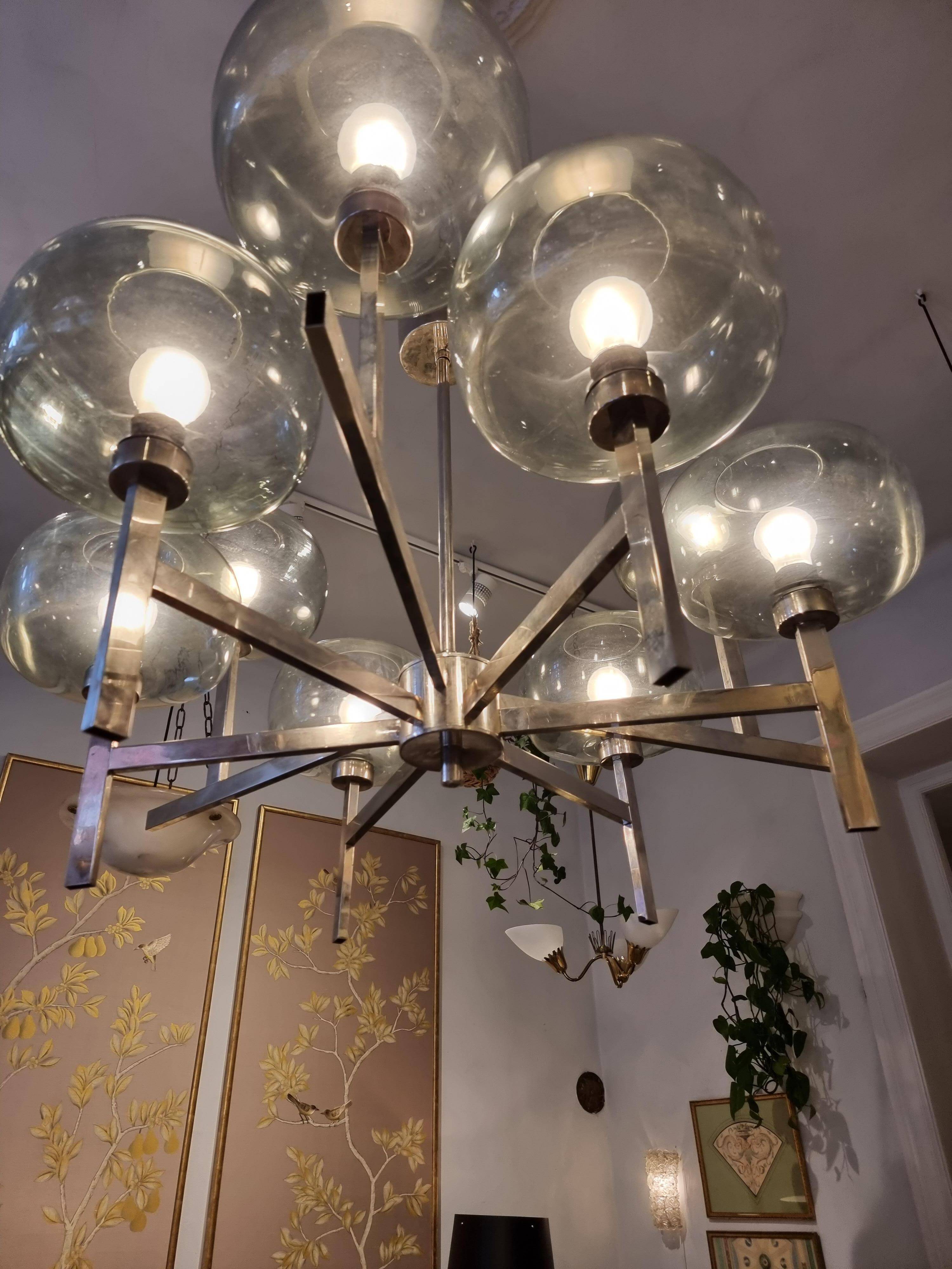 Timeless modern Scandinavian / mid-century chandelier in chrome and smoked glass.