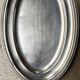 Oval silver-plated metal dish with palmette motif