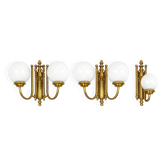 A set of 3 vintage brass wall lights with frosted glass globes, 1960s