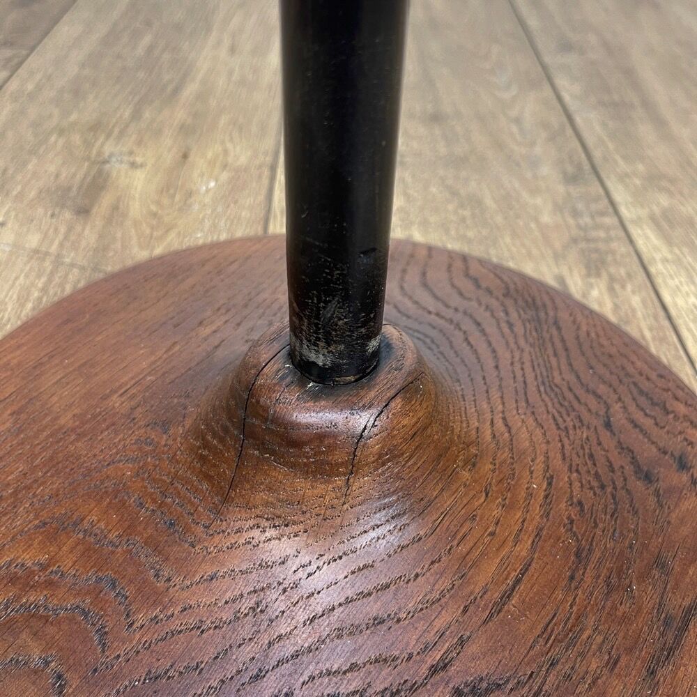 Brass ashtray on metal stand and wooden base