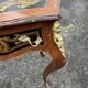 Louis XV style side table with marquetry and gilded bronze.