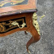 Louis XV style side table with marquetry and gilded bronze.