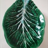 Vintage green slipware bowl in the shape of a cabbage leaf.