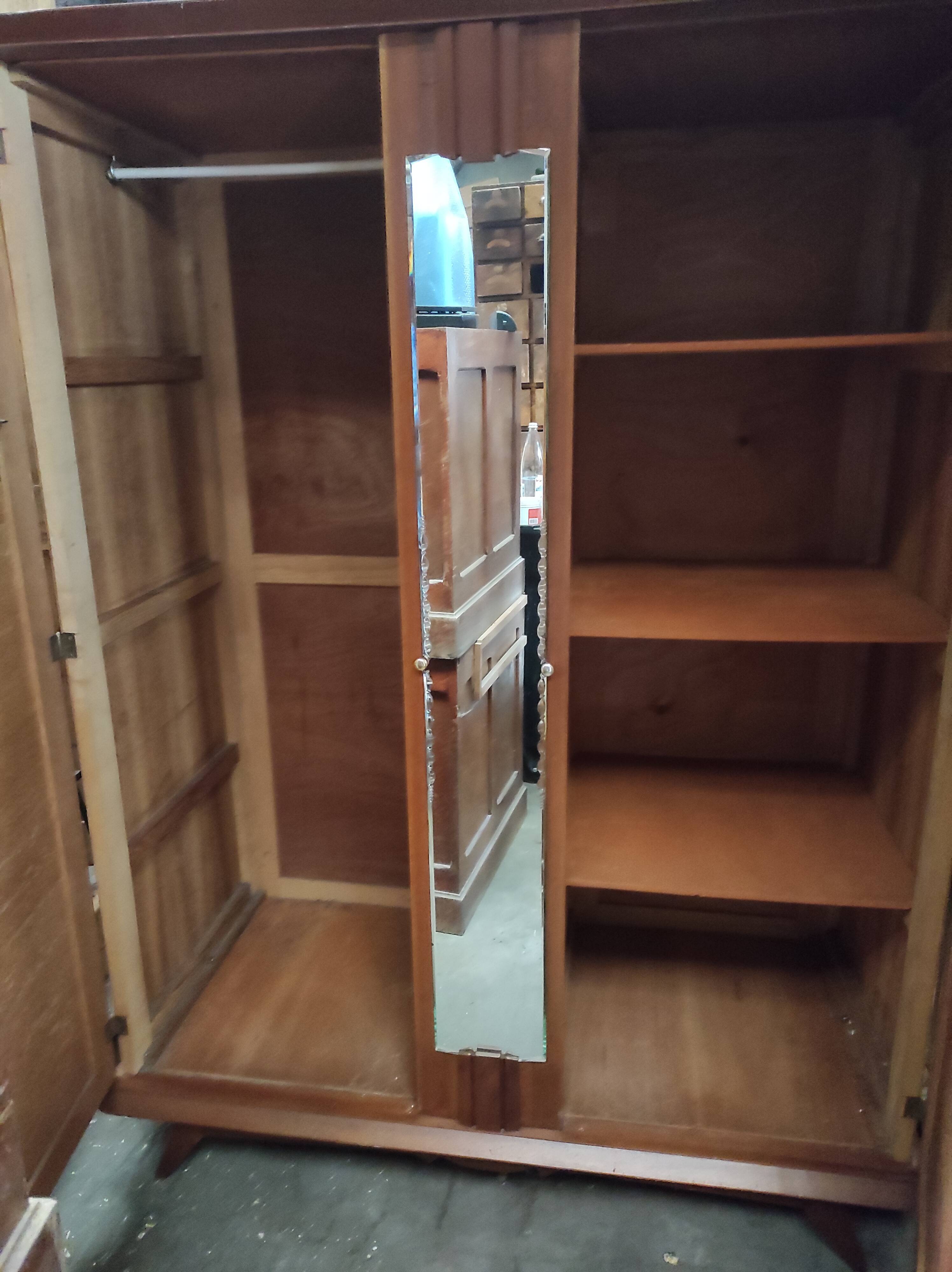 Vintage wardrobe with compass feet and central mirror Scandinavian style design