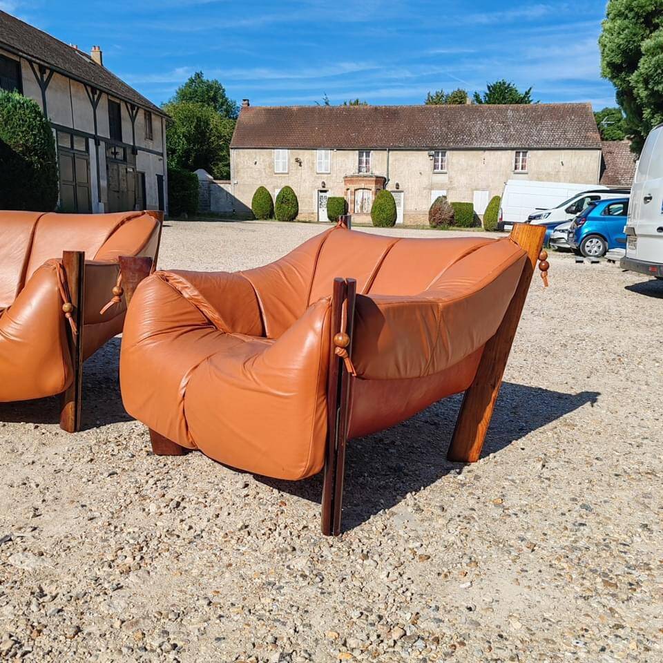 Percival lafer mp-211 sofa set with two armchairs and an ottoman in leather.