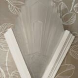 Pair of Art Deco wall sconces in plaster and pressed glass.