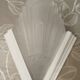 Pair of Art Deco wall sconces in plaster and pressed glass.