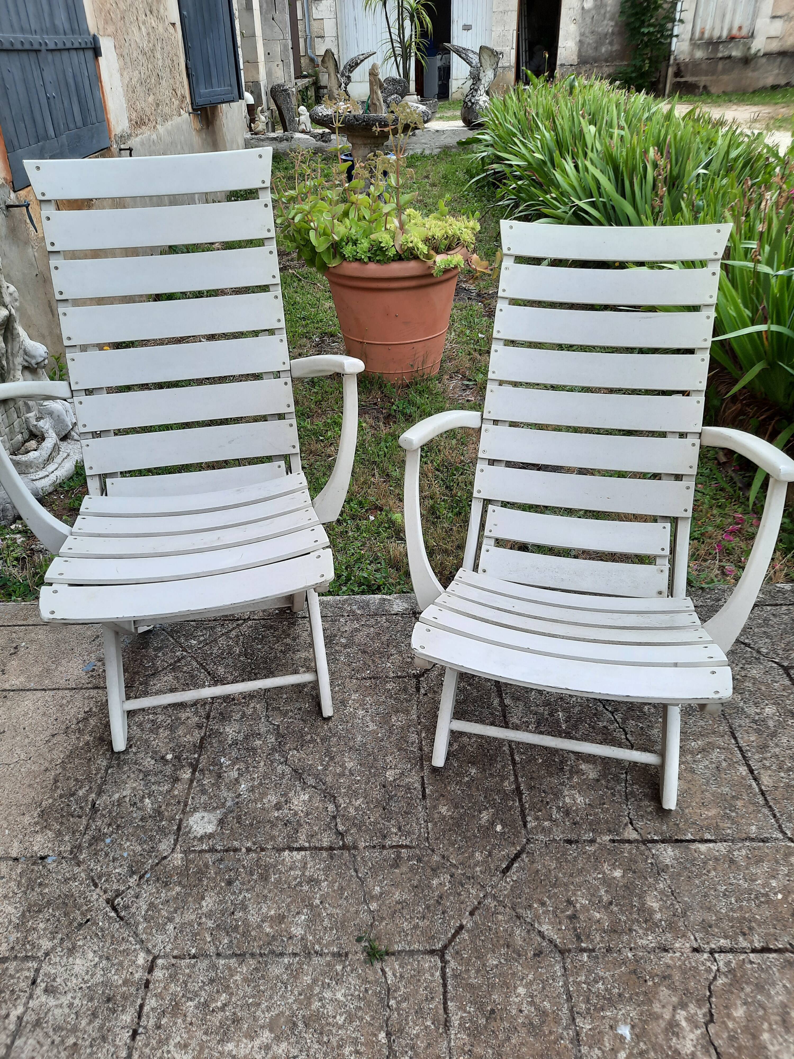 Pair of wooden garden armchairs
