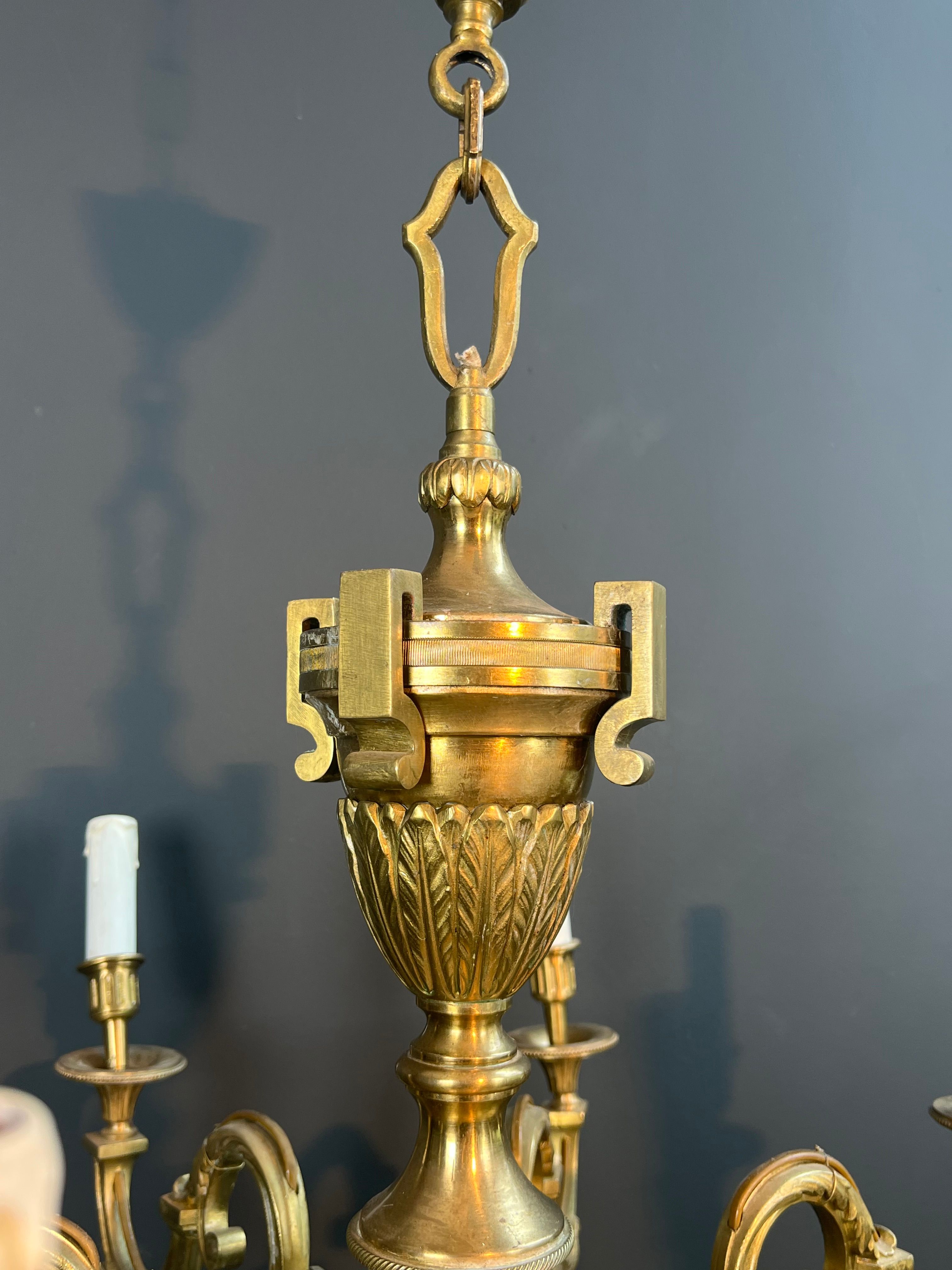 Important Louis XVI style chiseled bronze chandelier with 8 light arms by Lucien Gau