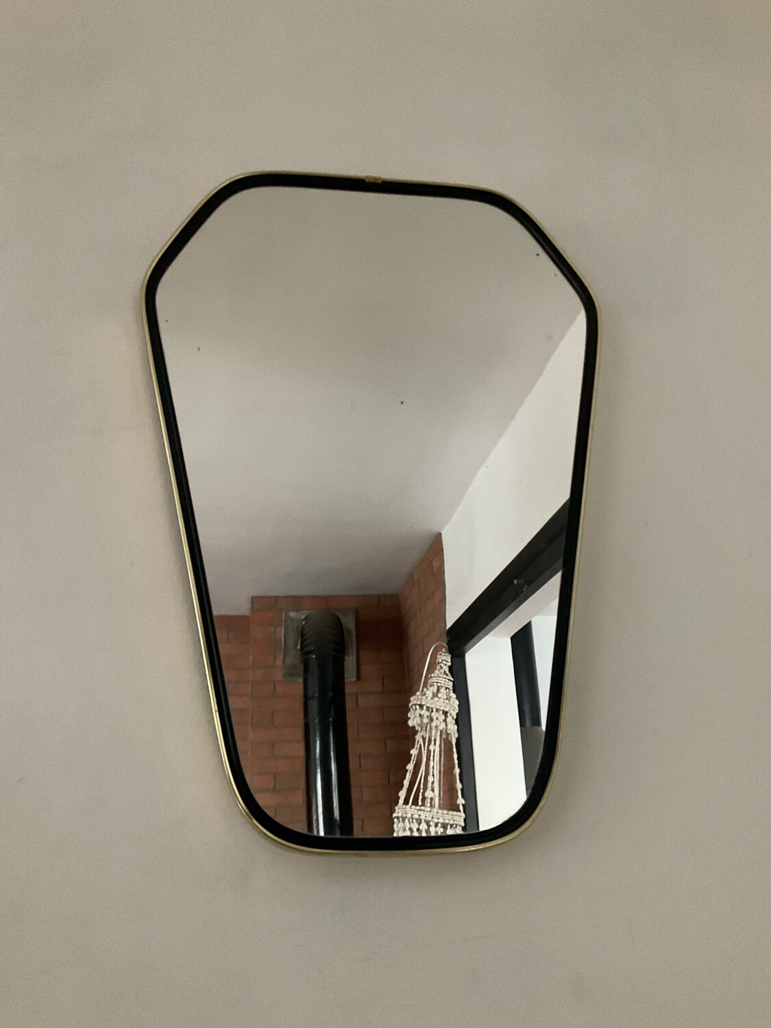 Asymmetrical free-form mirror from the 60s-70s