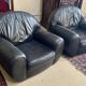 Pair of black leather club armchairs, twentieth century