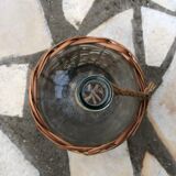 Bottle in clear glass with wicker