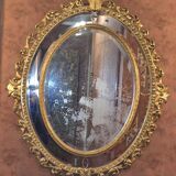 Miroir ovale en bois doré