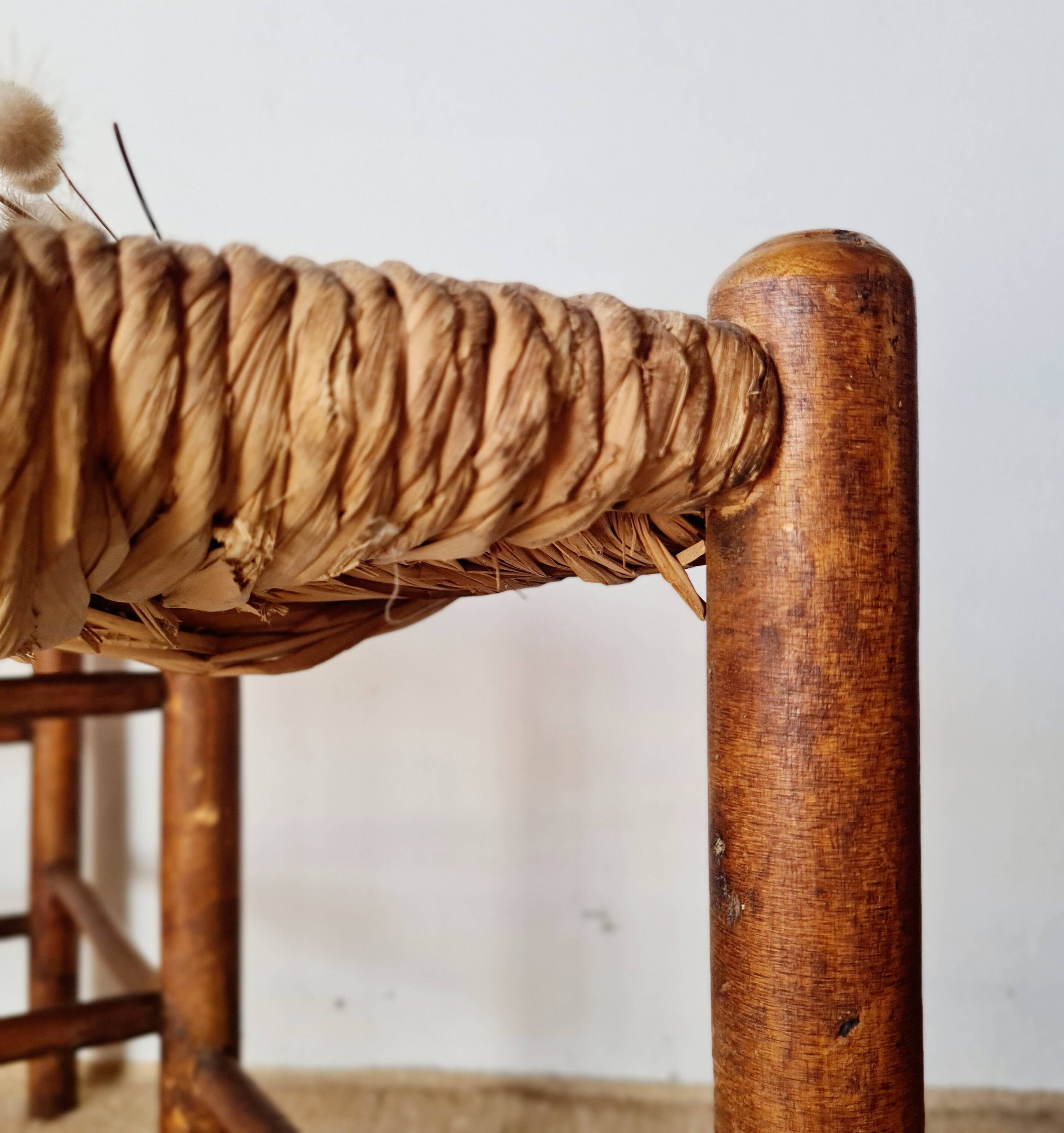 Old wooden and straw bench