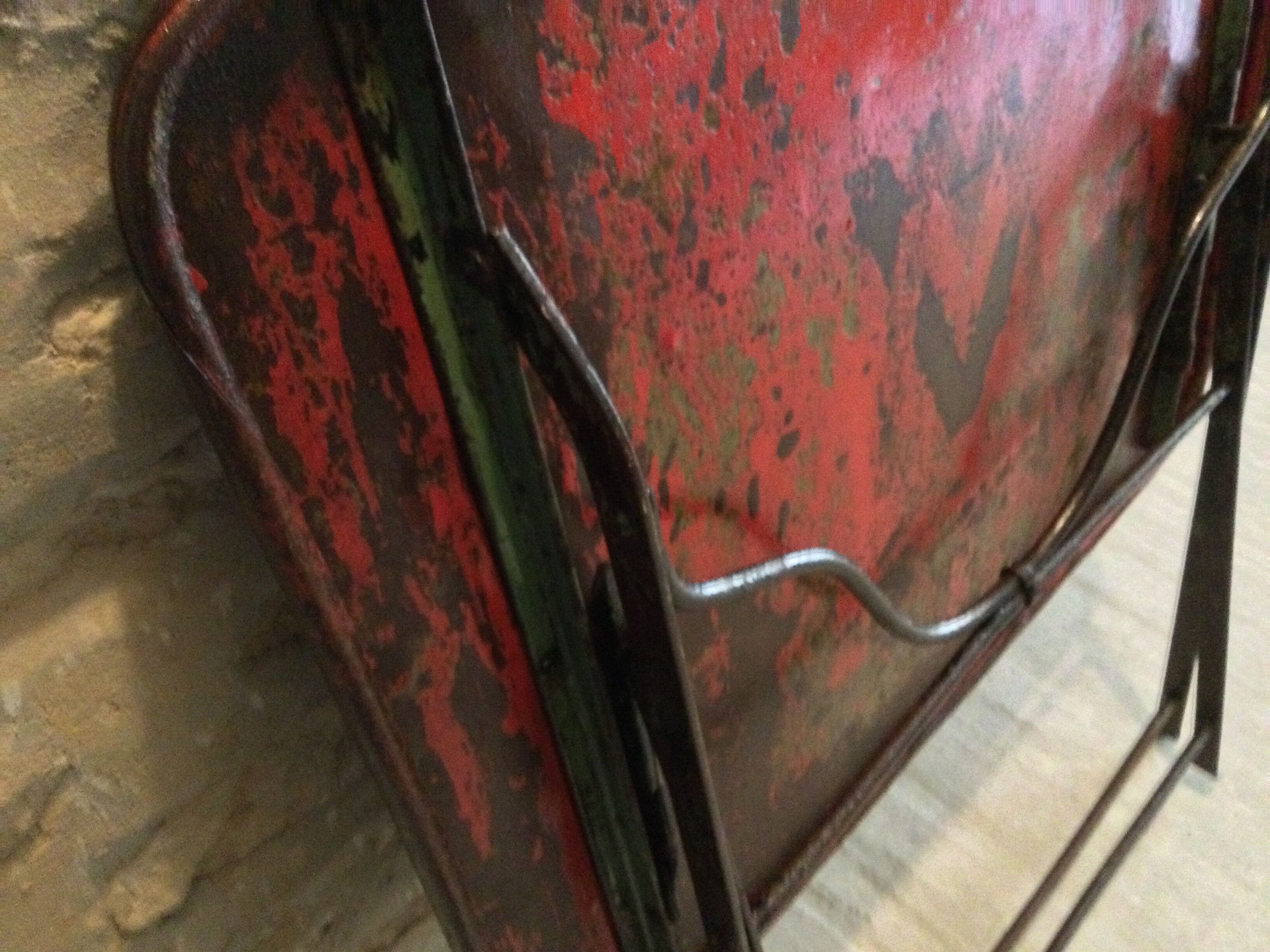 Folding riveted iron table