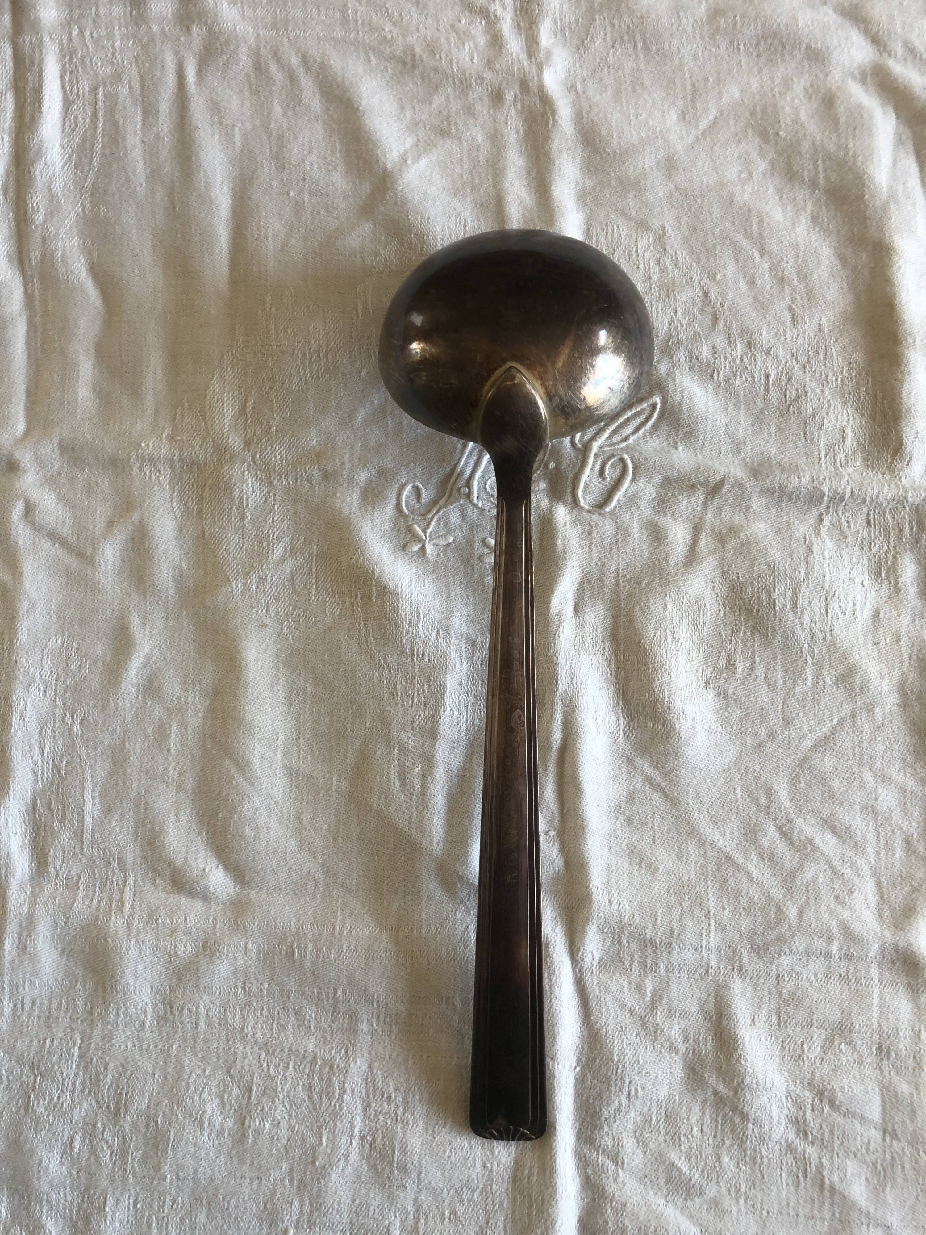 Large silver ladle