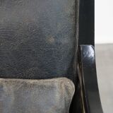 Black Art Deco design cow leather and wooden armchair with loose cushion