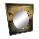 Oval mirror in duck pattern frame