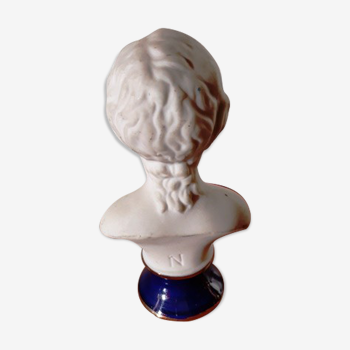 Bust of a child in biscuit porcelain base