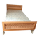 Vintage 1970s single rattan bed in blond wood