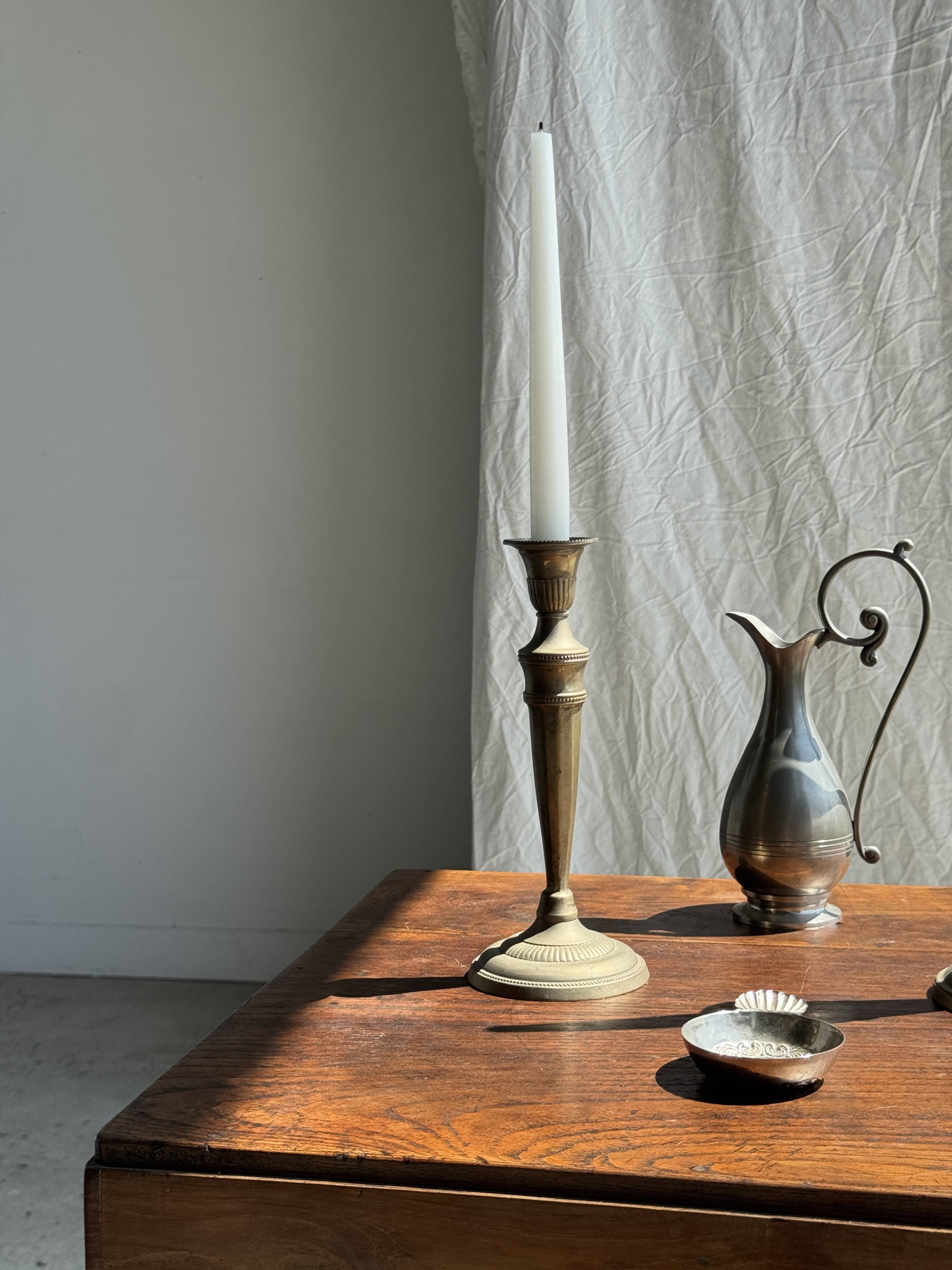 Pair of classic candlesticks in patinated gold metal H25