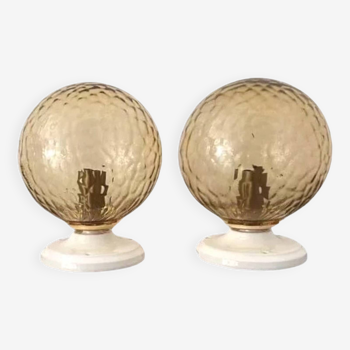 Pair of golden globe wall lights