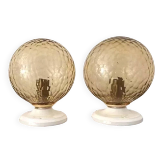 Pair of golden globe wall lights