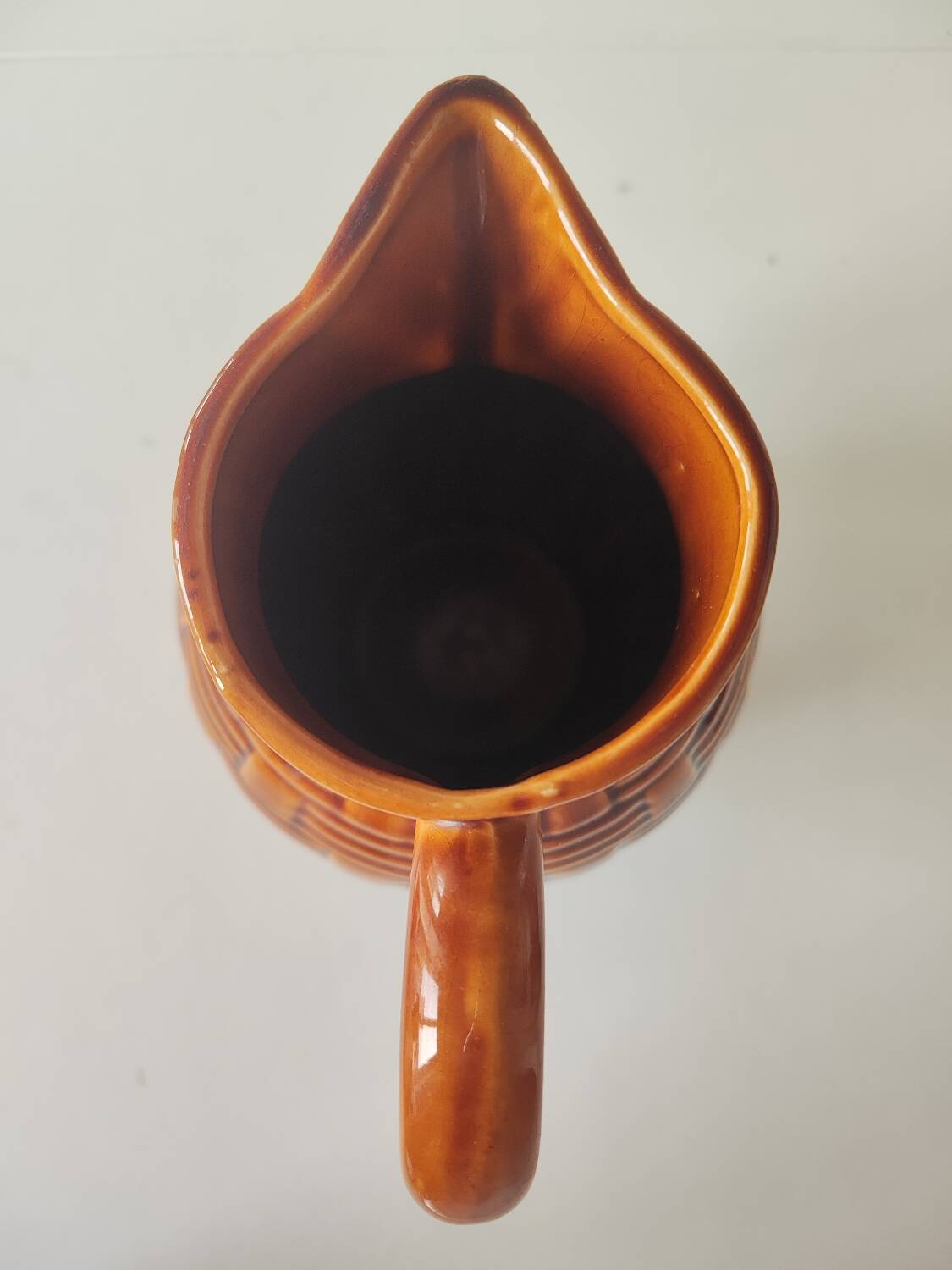 Caramel brown pitcher in glazed ceramic with barbotine finish from the 60s