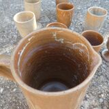 Service mazagrans and decanter in enamelled stoneware.