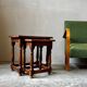 Pair of antique nesting tables made of turned wood.