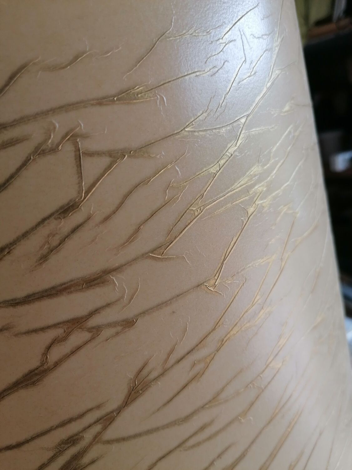 Vintage ceramic table lamp and golden lampshade.