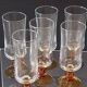6 amber-footed champagne flutes in very good condition.