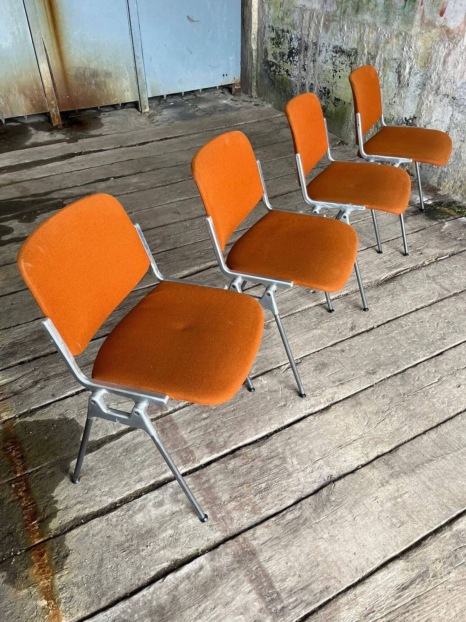 DSC 106 chair in orange by Giancarlo Piretti for Castelli, 1970s.