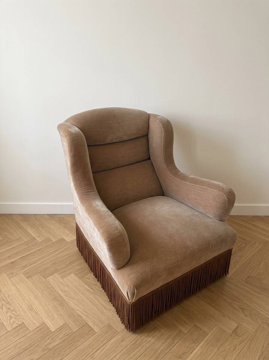 Vintage 1970s armchair in beige fabric with fringes.