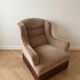 Vintage 1970s armchair in beige fabric with fringes.