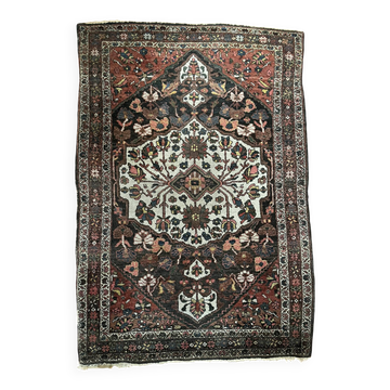 Antique handmade Hamadan Persian rug, ivory medallion on dark background 148x103.