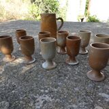 Service mazagrans and decanter in enamelled stoneware.