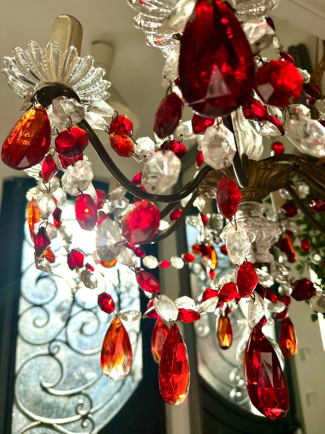 Antique chandelier with red crystal pendants, 9 lights.