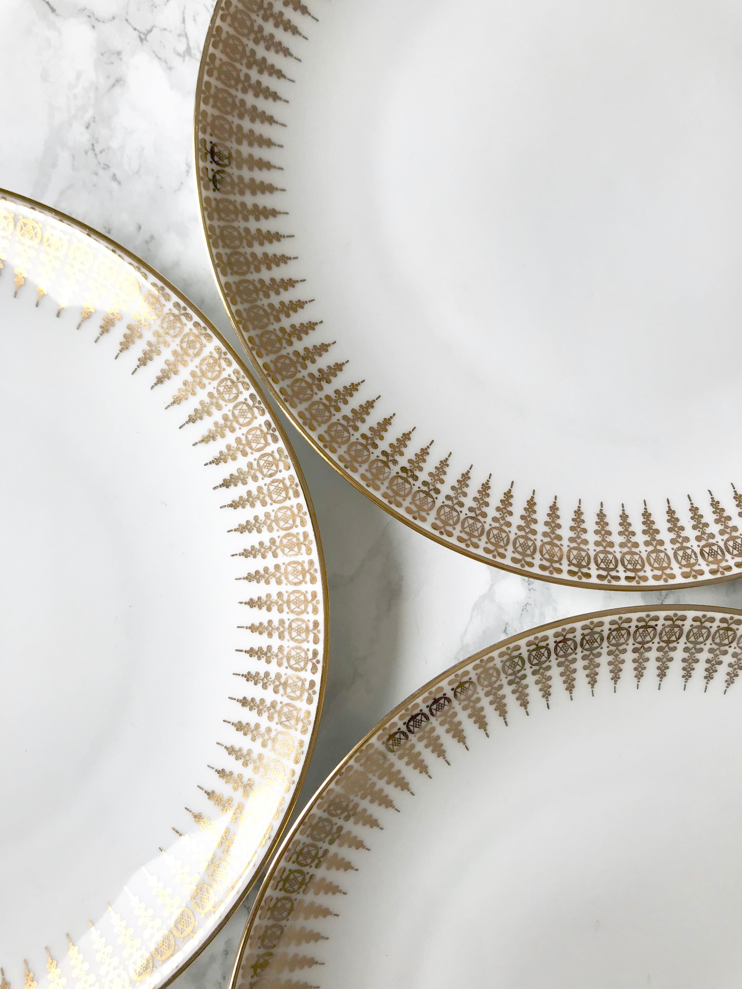 Six white and gold porcelain dessert plates