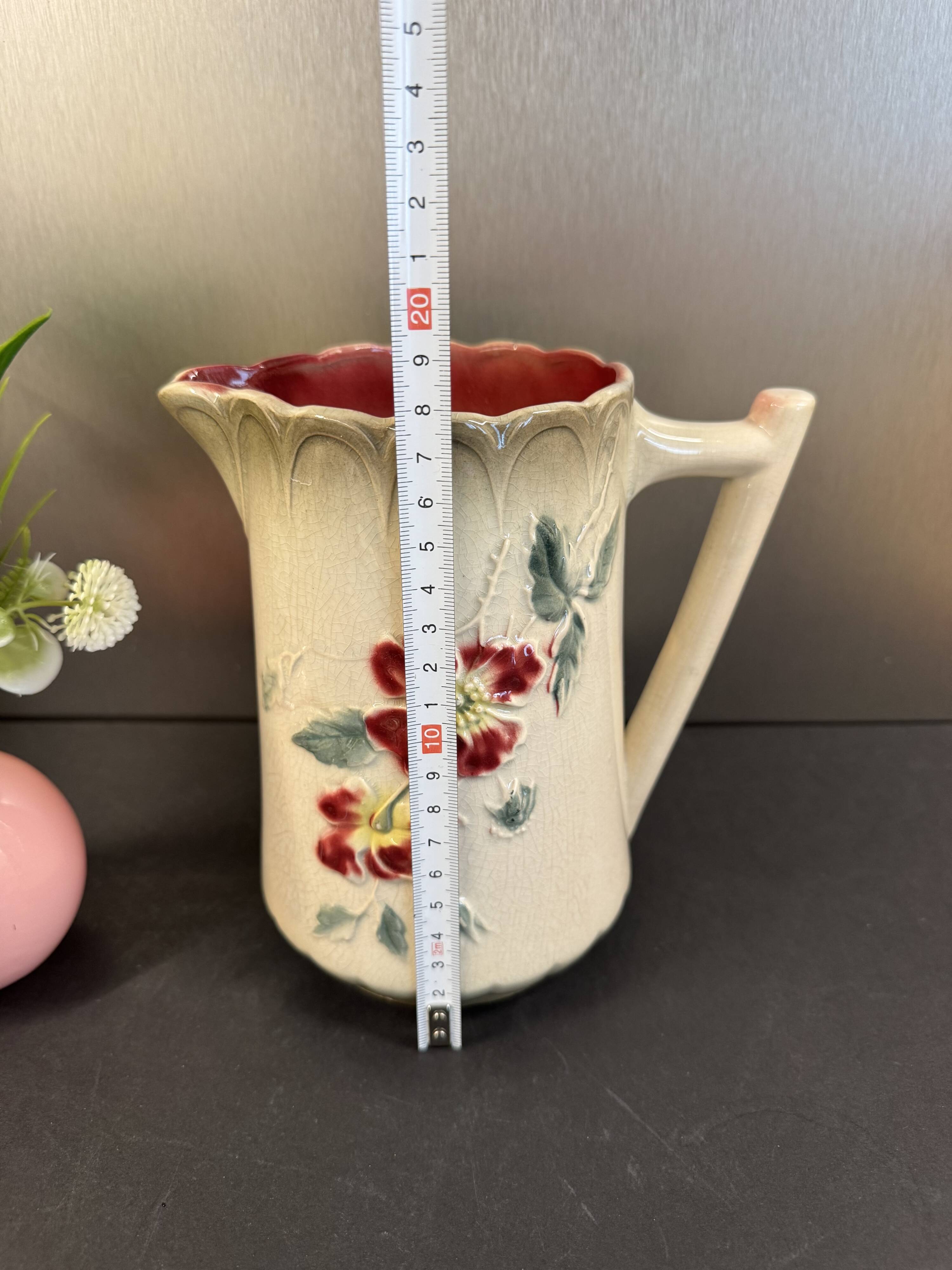 Antique pitcher in slipware with floral decoration – red and cream floral design