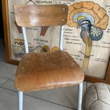 Old wooden and metal children's school chair
