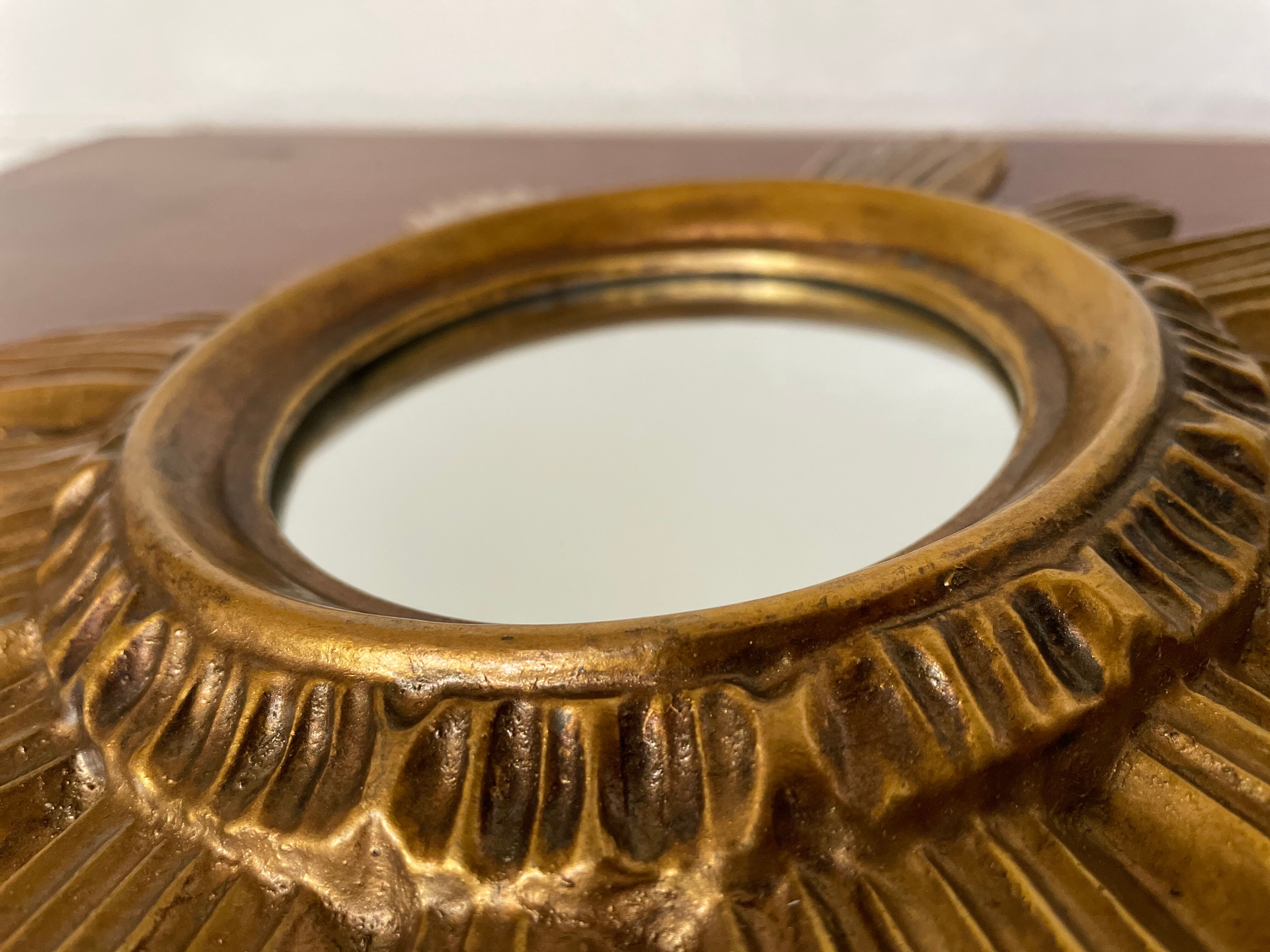 Vintage sun mirror in 60s/70s gold resin