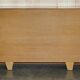 Vintage buffet made of mottled yew wood with three doors and four drawers.