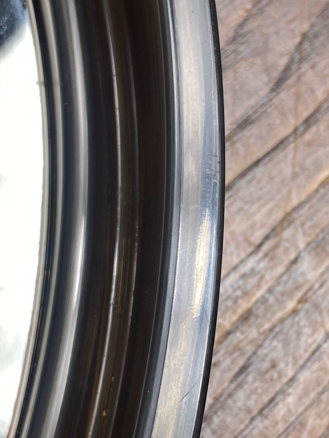 Circular mirror, smoked plastic, 1960s/70s.