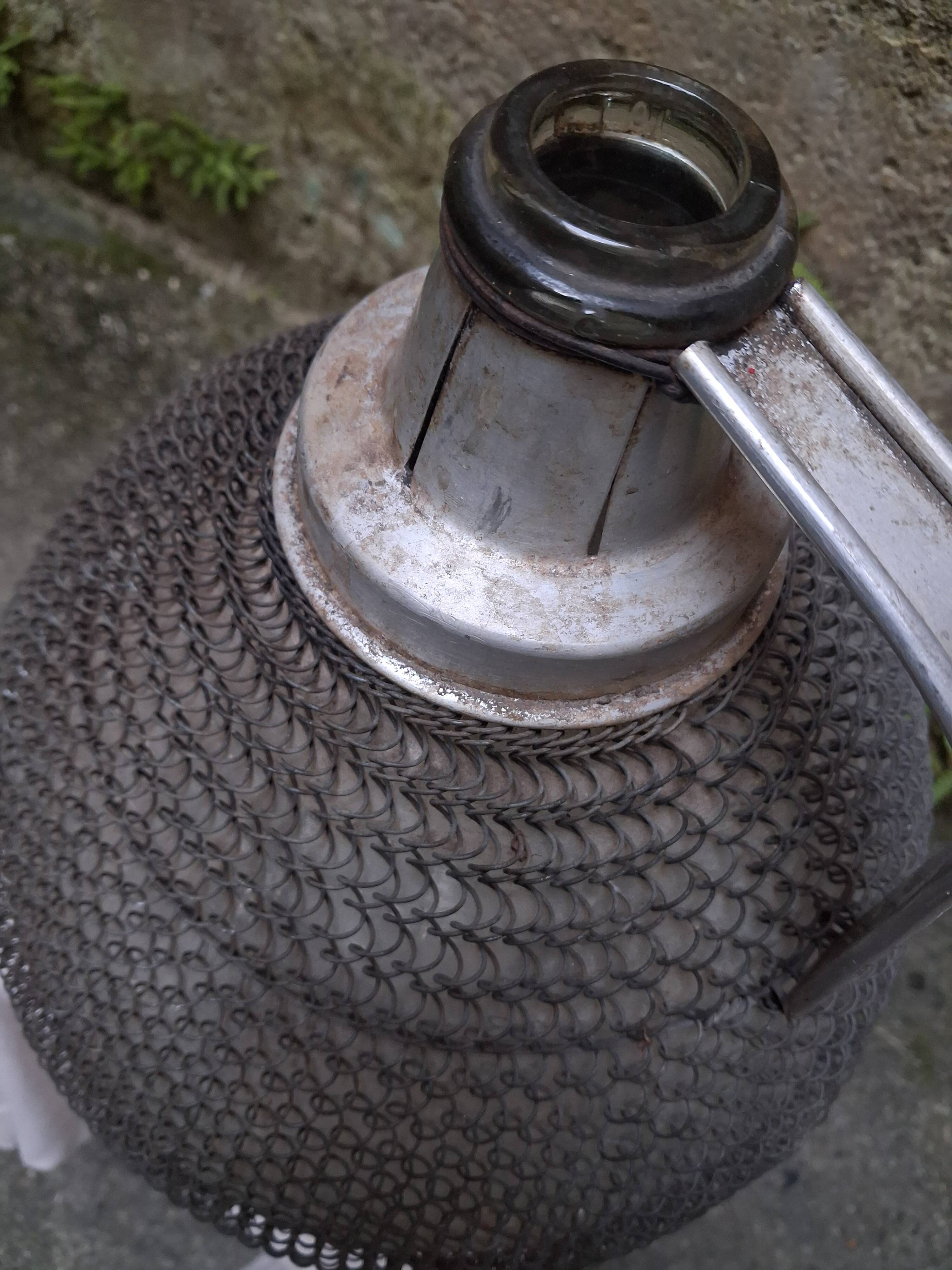 Demijohn, glass demijohn, with protective metal mesh, 1950-1960