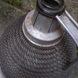 Demijohn, glass demijohn, with protective metal mesh, 1950-1960