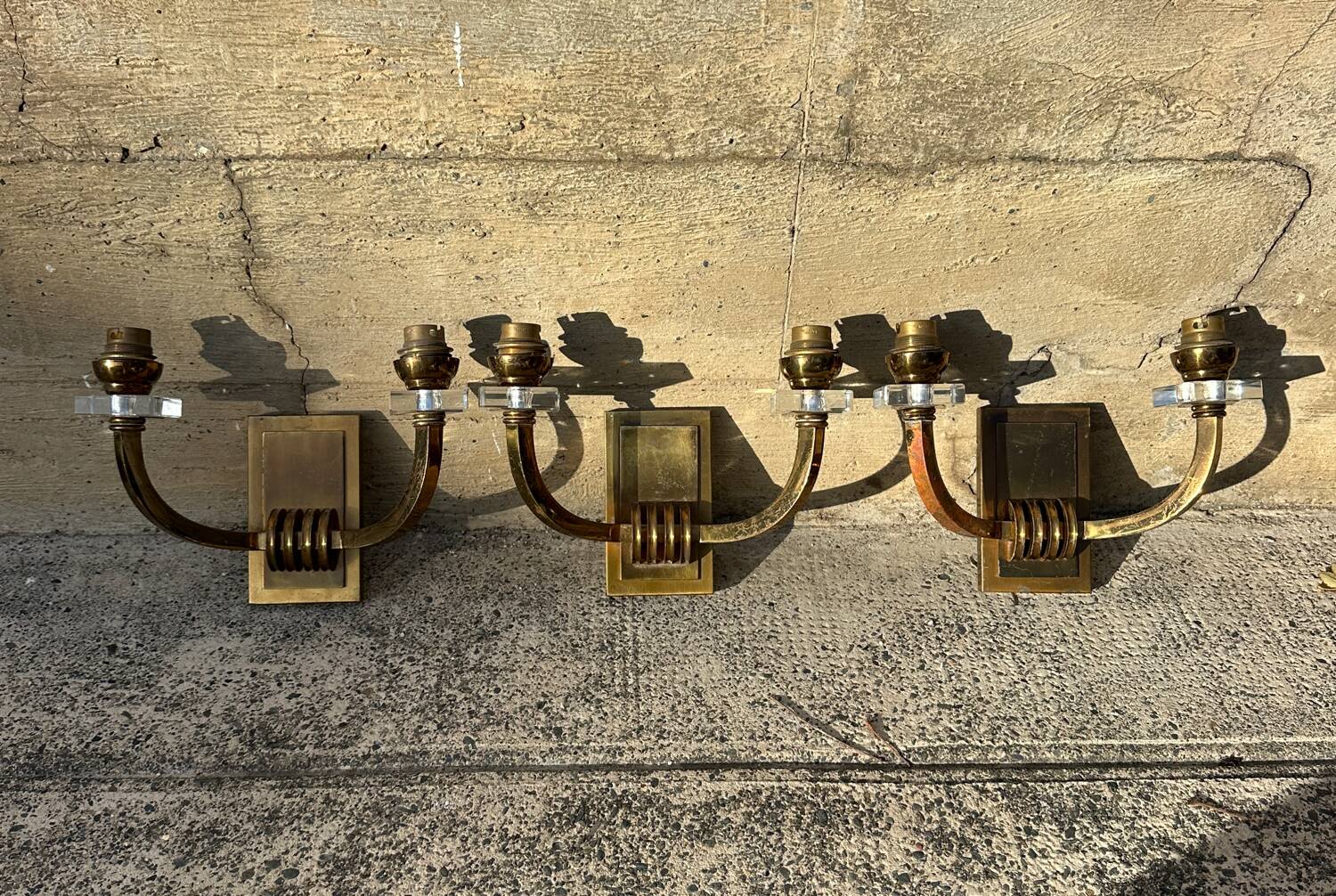 Antique Art Deco wall sconces attributed to Jacques Adnet.