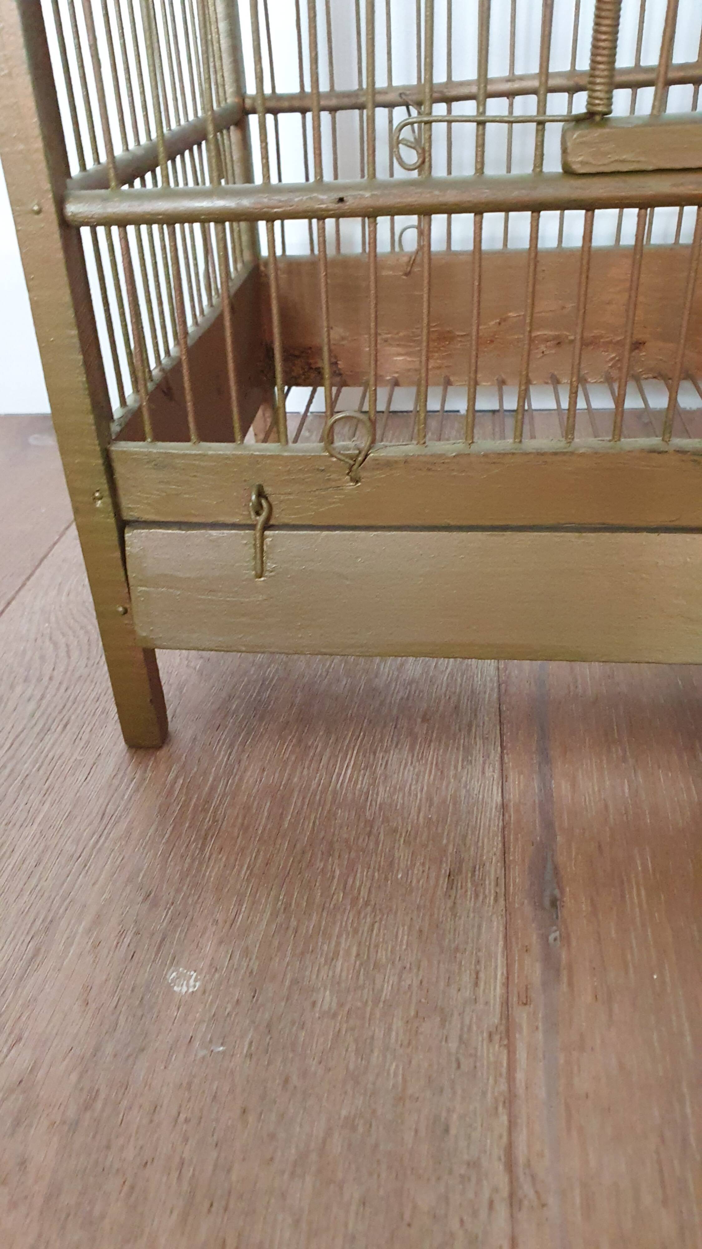 Wooden and gilded metal birdcage