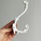 Bathroom décor, hooks, soap dish, white metal hangers.
