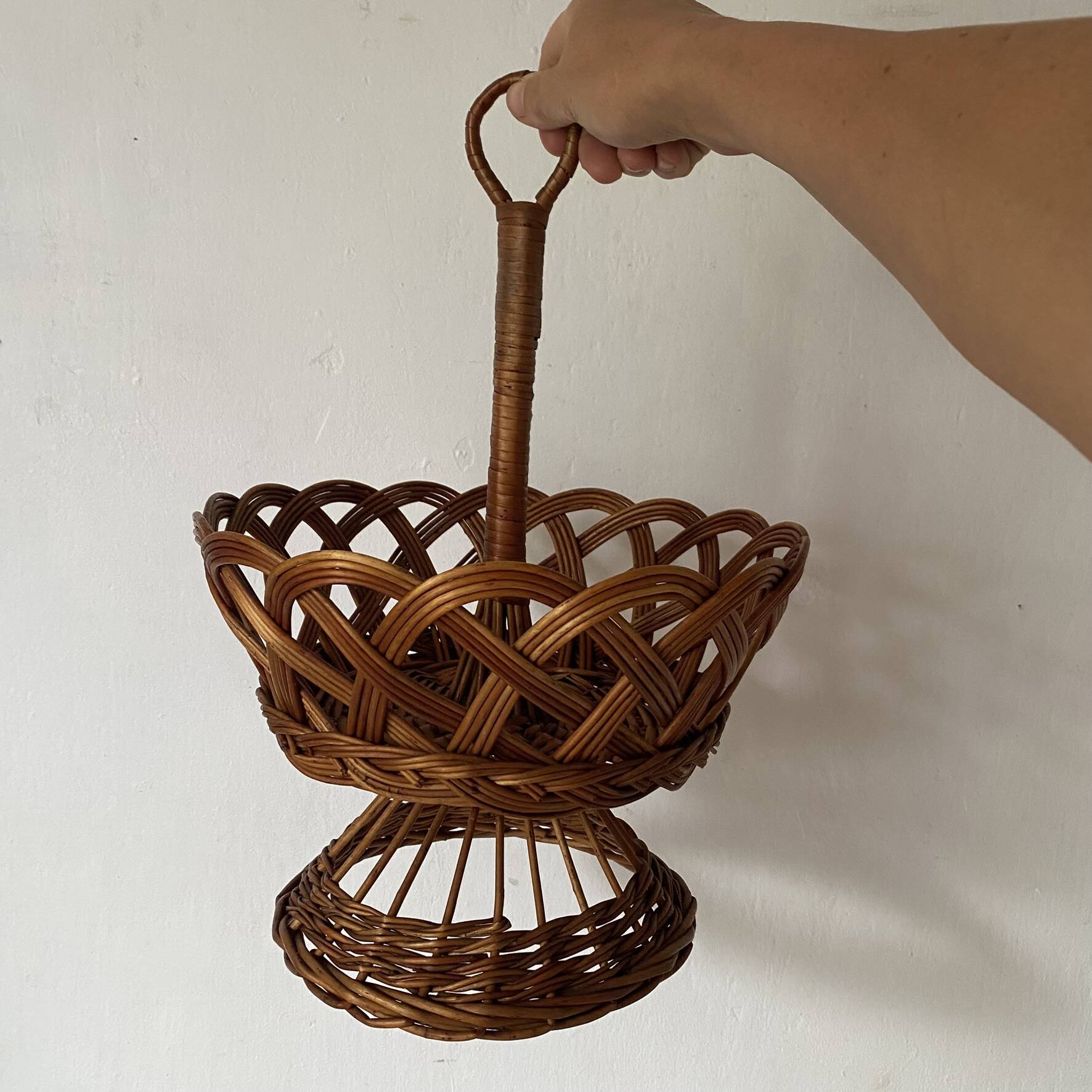 Wicker fruit bowl on a stand
